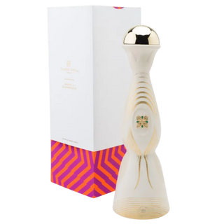 Decorative wooden object with gold top next to a white box with colorful design
