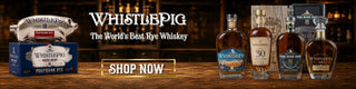 WhistlePig whiskey bottles and packaging on a wooden surface with 'Shop Now' button.